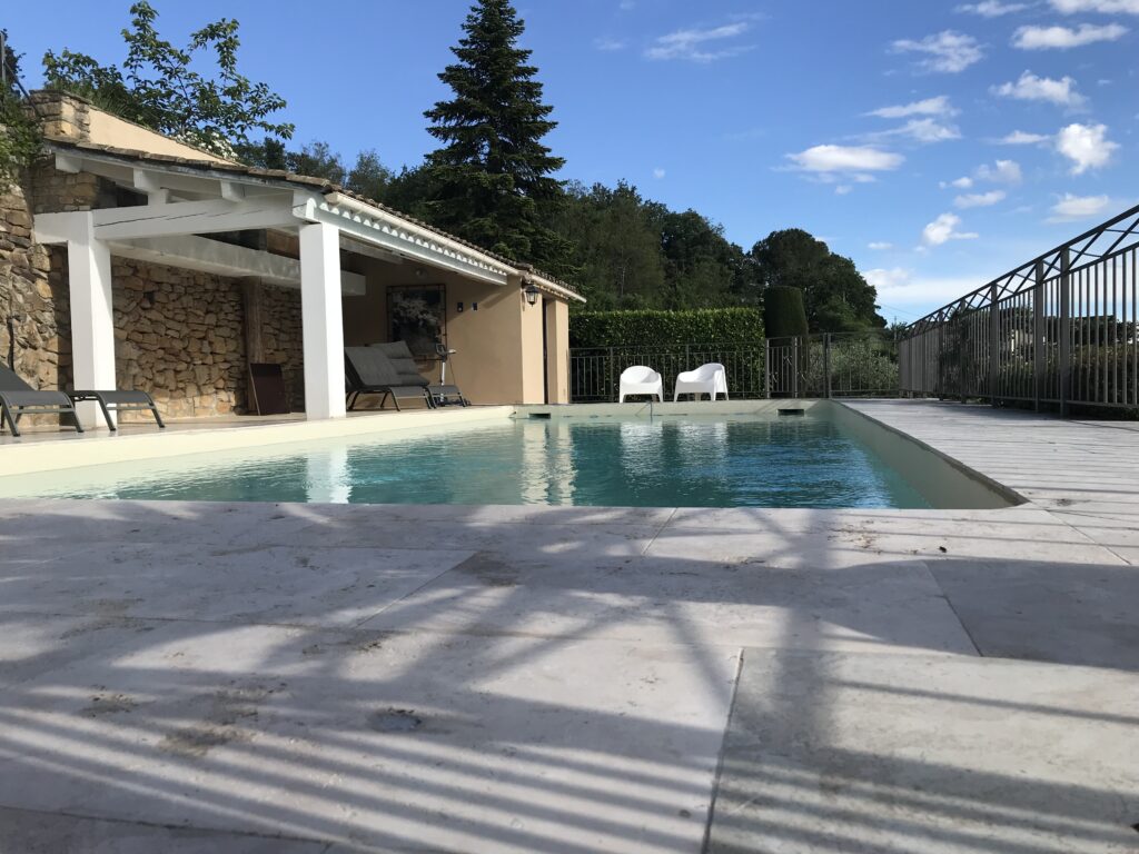 The exterior exists of a swimmingpool for taking a refreshing dip.